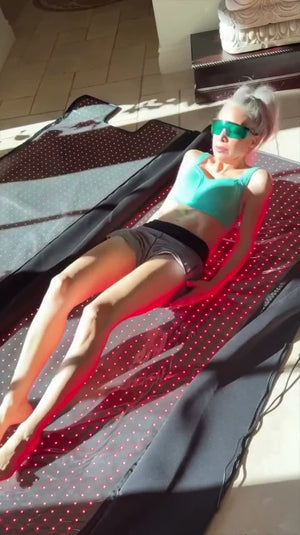 Woman with goggles lying on the mat